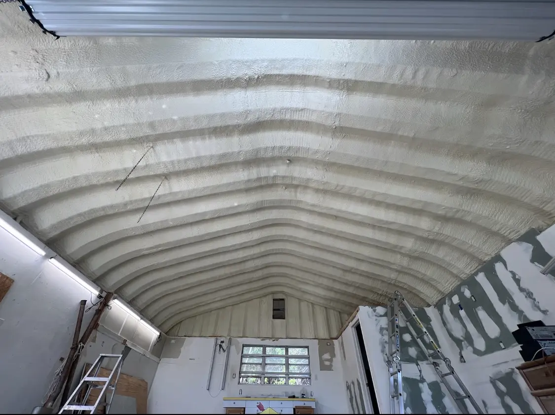 Spray polyurethane foam applied to the underside of a metal roof deck in Broadview
